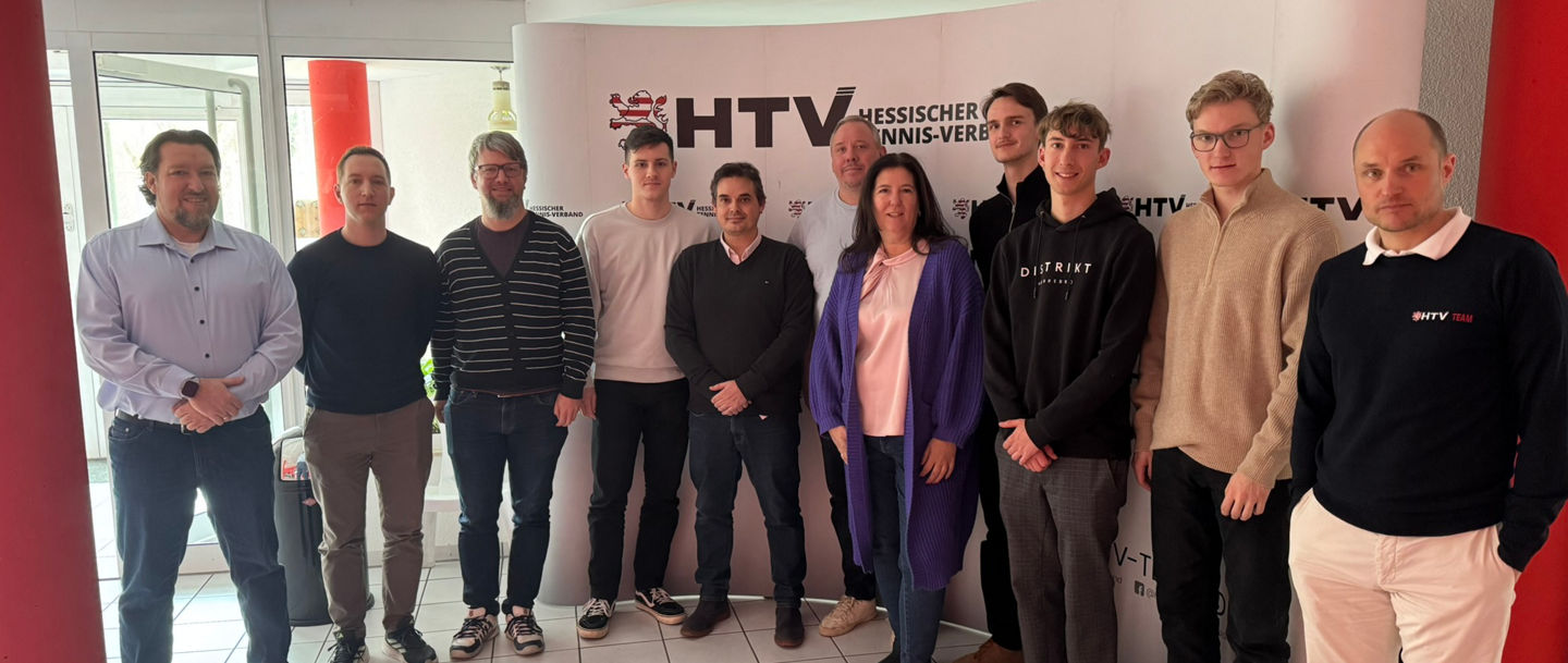 Group of People Standing at HTV Event Backdrop