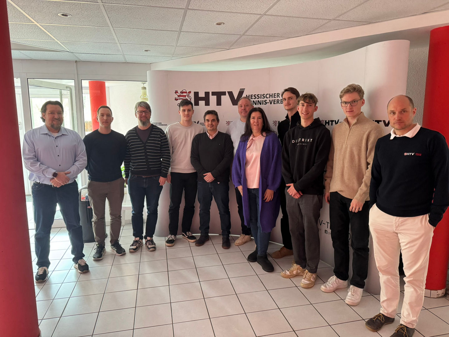 Group of People Standing at HTV Event Backdrop