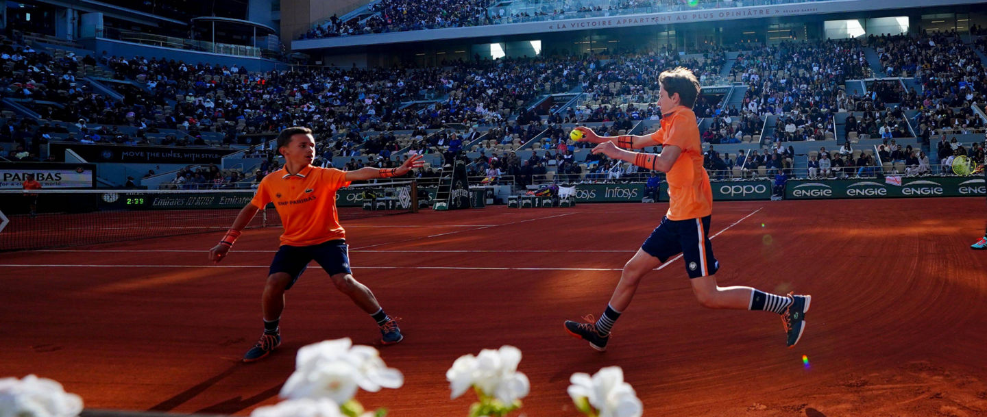 Tennis players in action on clay court