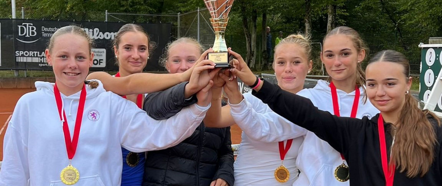 Group Celebrating Tennis Trophy Win Outdoors