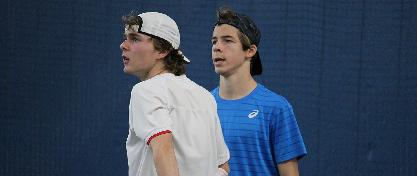 Two tennis players on indoor court