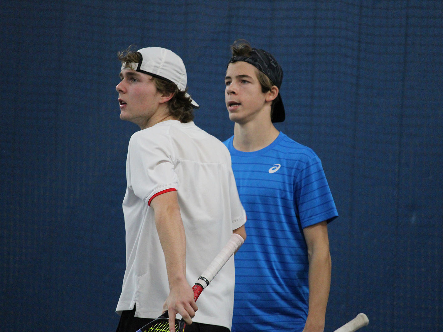 Two tennis players on indoor court