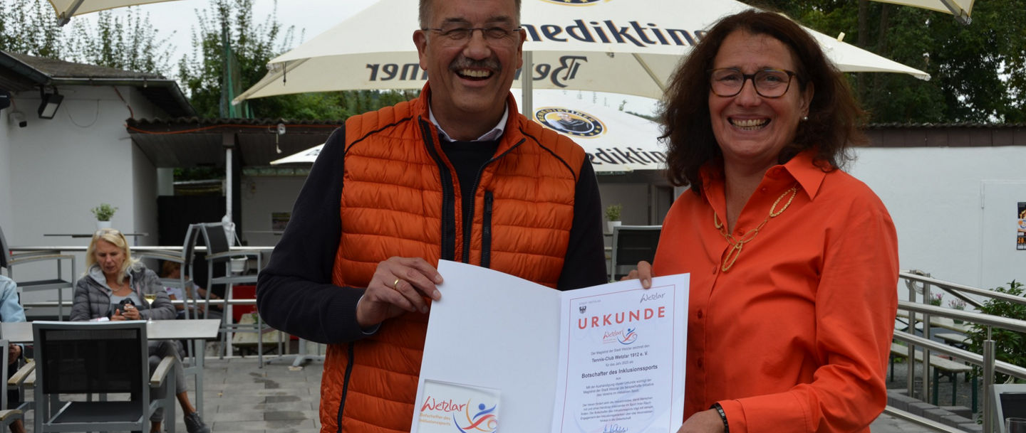 Certificate presentation in outdoor setting