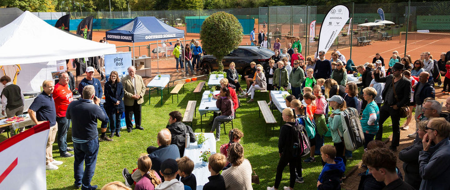 Outdoor community event at tennis courts