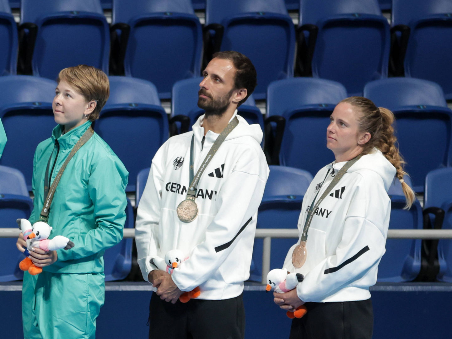 JAPAN, TOKYO - NOVEMBER 23, 2025: Silver medallists Jaroslav Smedek and Katerina Blascikova of the Czech Republic, gold medal winners, Russia s Dmitry Dolzhenkov and Polina Smirnova and bronze medallists Urs Breitenberger and Heike Albrecht-Schroeder of Germany L-R during the victory ceremony for the mixed doubles tennis event at Ariake Tennis Park during the 2025 Summer Deaflympic Games. Mikhail Sinitsyn/TASS PUBLICATIONxINxGERxAUTxONLY 85891595