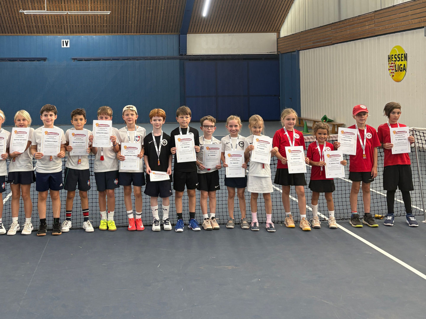 Group of children with certificates indoors